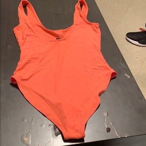 Brand new orange body suit